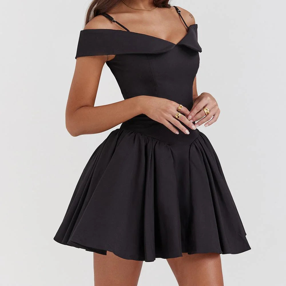 Model wearing an elegant off-the-shoulder mini cocktail dress in black