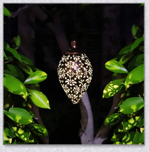 Decorative, solar-powered metal lantern for hanging in outdoor gardens, patios, and backyards