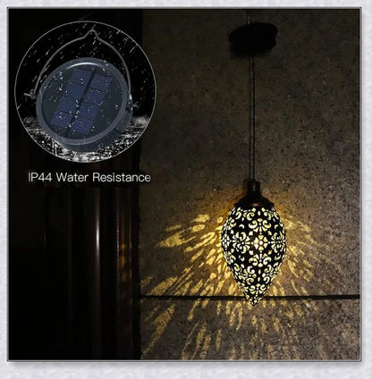 Decorative, solar-powered metal lantern for hanging in outdoor gardens, patios, and backyards