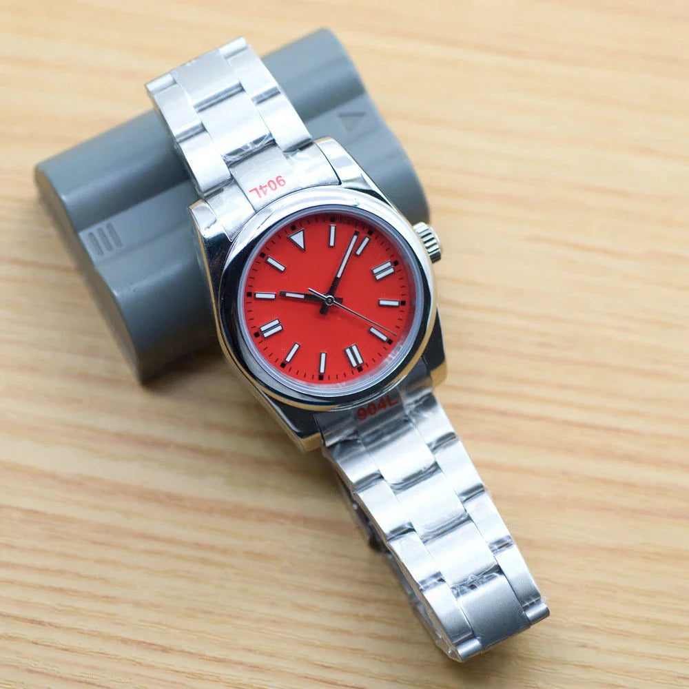 A stainless steel watch with luminous hands and indices, showcasing a sleek and sophisticated design.