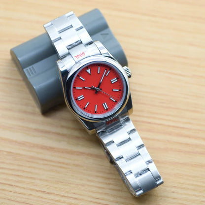 A stainless steel watch with luminous hands and indices, showcasing a sleek and sophisticated design.