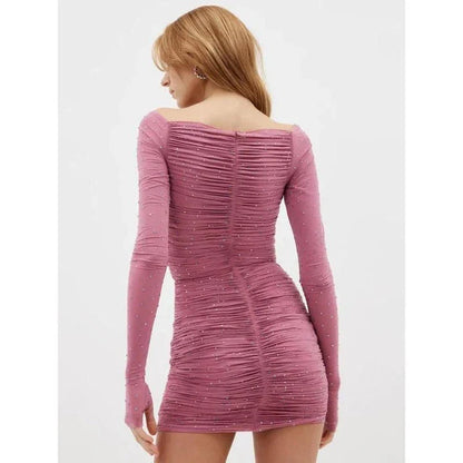 Glittering hollow-out mini dress in apricot color, featuring a strapless design, sheath silhouette, and eye-catching hollow-out pattern