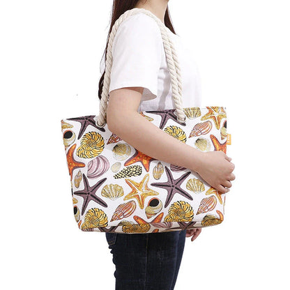 Stylish canvas beach tote bag with a charming Shells Conch print, perfect for summer adventures and everyday use.