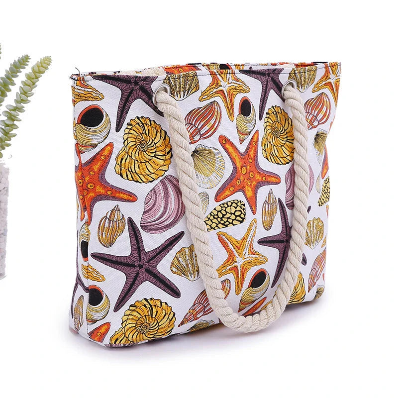 Stylish canvas beach tote bag with a charming Shells Conch print, perfect for summer adventures and everyday use.
