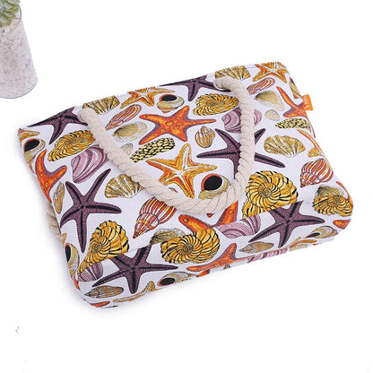Stylish canvas beach tote bag with a charming Shells Conch print, perfect for summer adventures and everyday use.