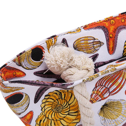 Stylish canvas beach tote bag with a charming Shells Conch print, perfect for summer adventures and everyday use.