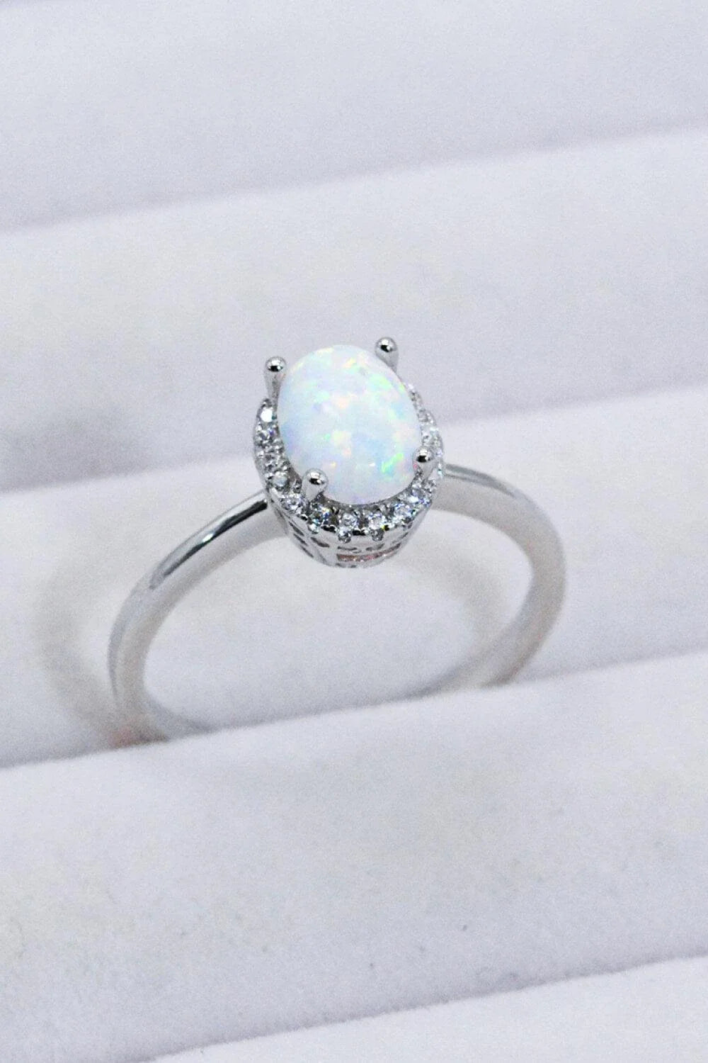 925 Sterling Silver 4-Prong Opal Ring with a dazzling opal center stone and platinum plated finish