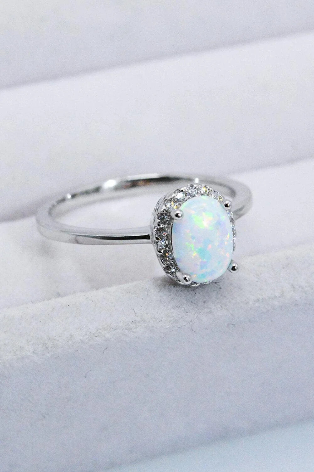 925 Sterling Silver 4-Prong Opal Ring with a dazzling opal center stone and platinum plated finish
