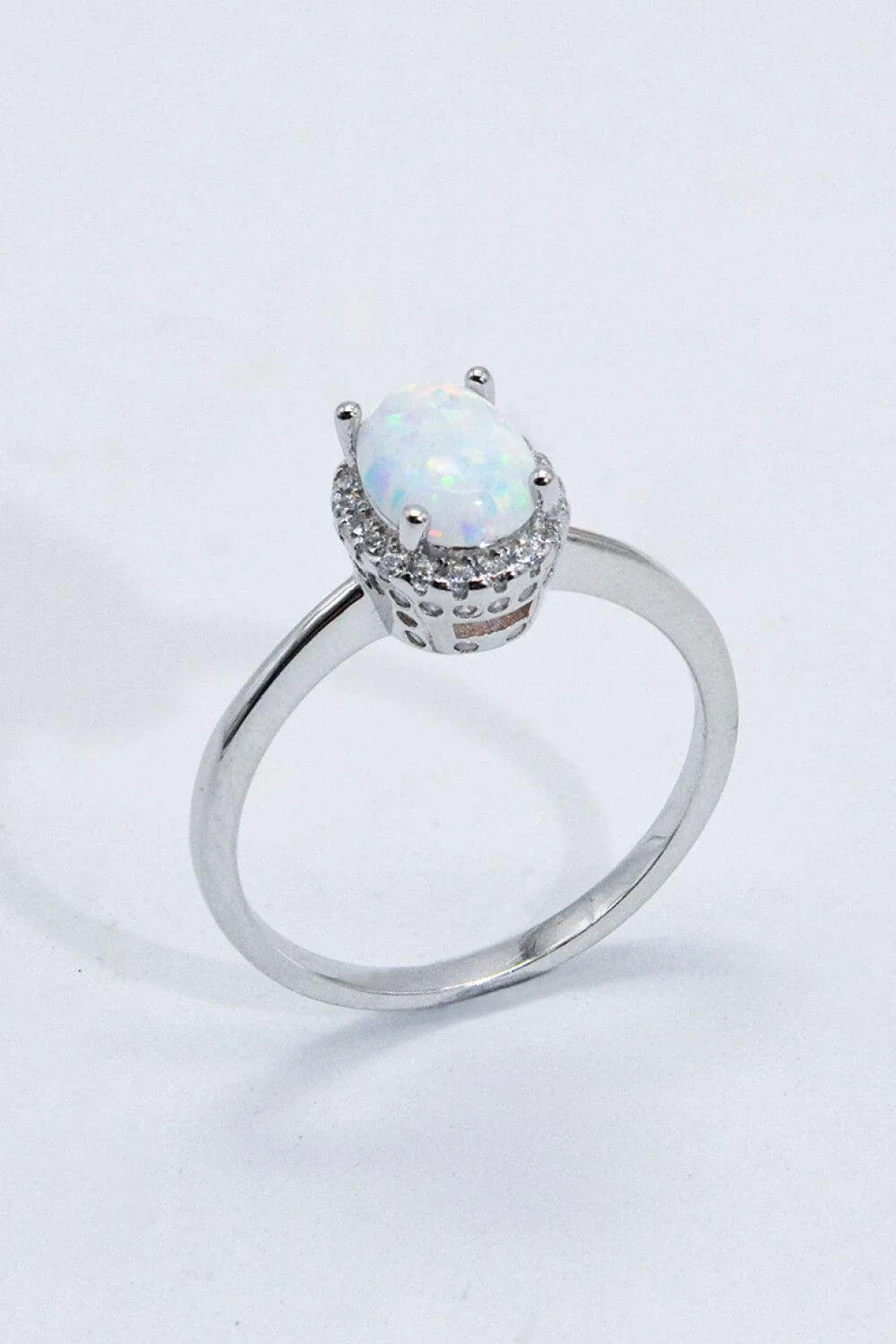 925 Sterling Silver 4-Prong Opal Ring with a dazzling opal center stone and platinum plated finish