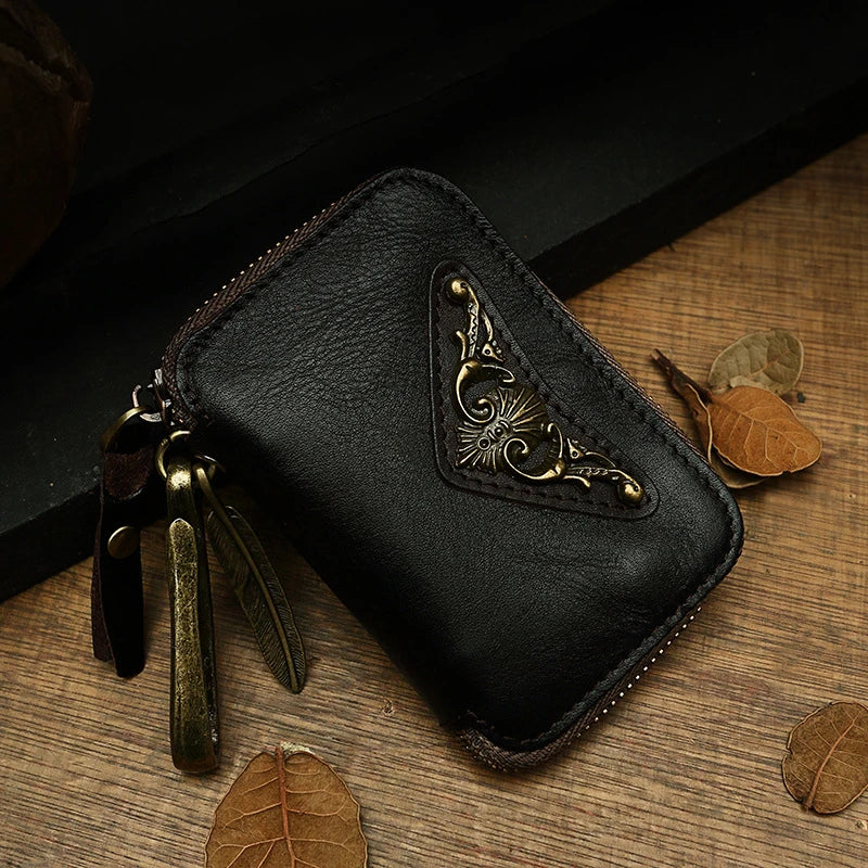 Handmade cowhide leather key bag with a heart-shaped design, available in black, brown, and light brown colors