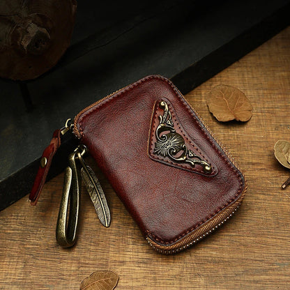 Handmade cowhide leather key bag with a heart-shaped design, available in black, brown, and light brown colors