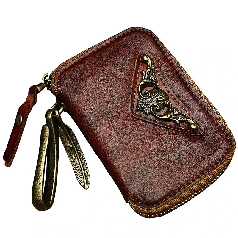Handmade cowhide leather key bag with a heart-shaped design, available in black, brown, and light brown colors