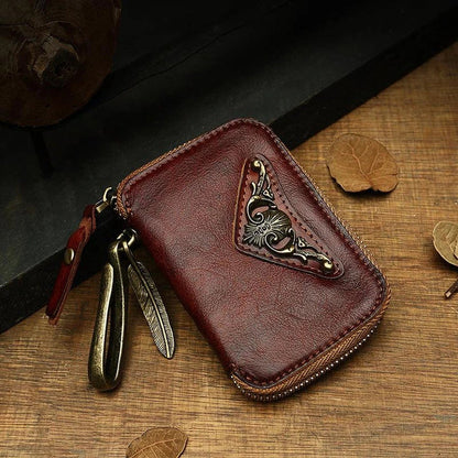 Handmade cowhide leather key bag with a heart-shaped design, available in black, brown, and light brown colors
