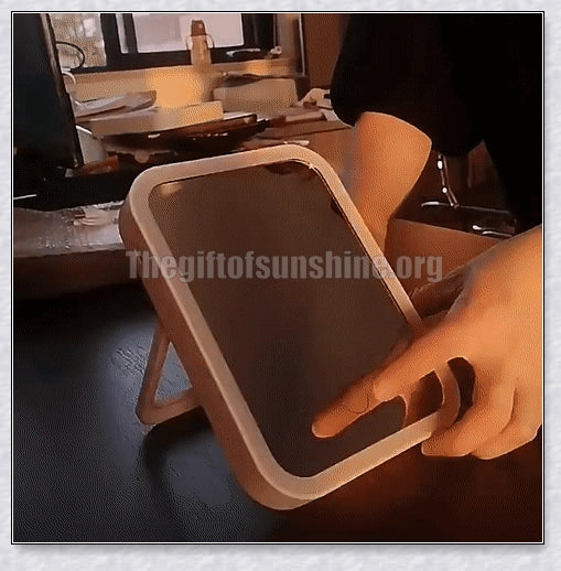 Smart makeup mirror with touch screen controls, adjustable brightness, and 45-degree rotation for flawless makeup on the go