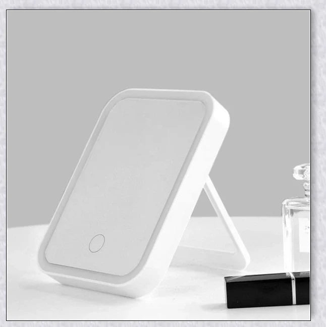 Smart makeup mirror with touch screen controls, adjustable brightness, and 45-degree rotation for flawless makeup on the go
