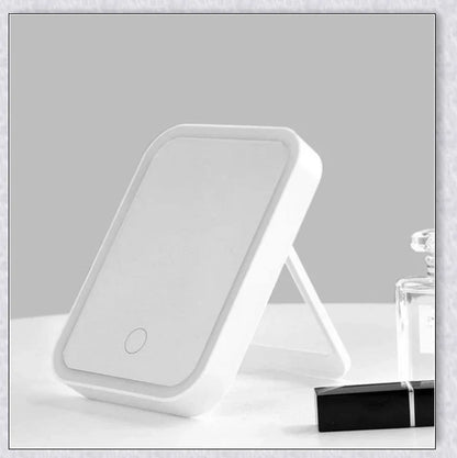 Smart makeup mirror with touch screen controls, adjustable brightness, and 45-degree rotation for flawless makeup on the go