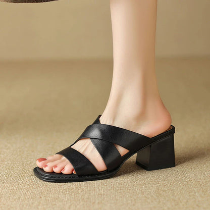 Luxurious black leather high-heel slippers with a stylish square heel and sleek design