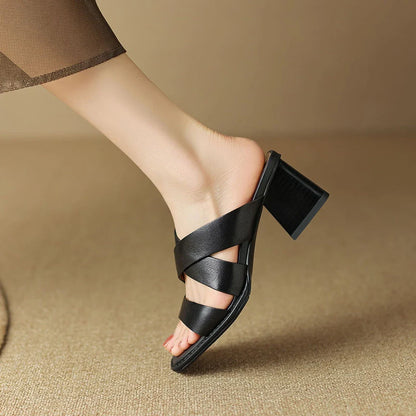Luxurious black leather high-heel slippers with a stylish square heel and sleek design