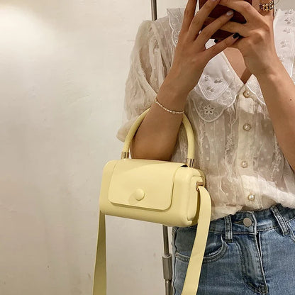 Fashionable portable square bag in various colors with a compact, minimalist design for everyday use