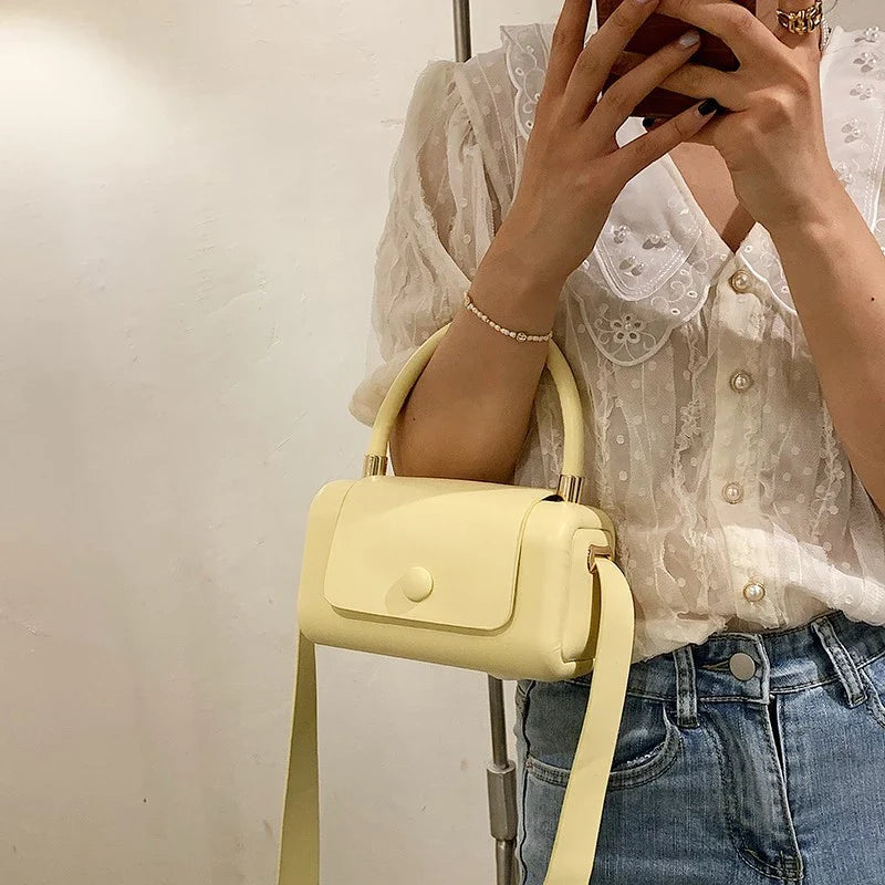 Fashionable portable square bag in various colors with a compact, minimalist design for everyday use