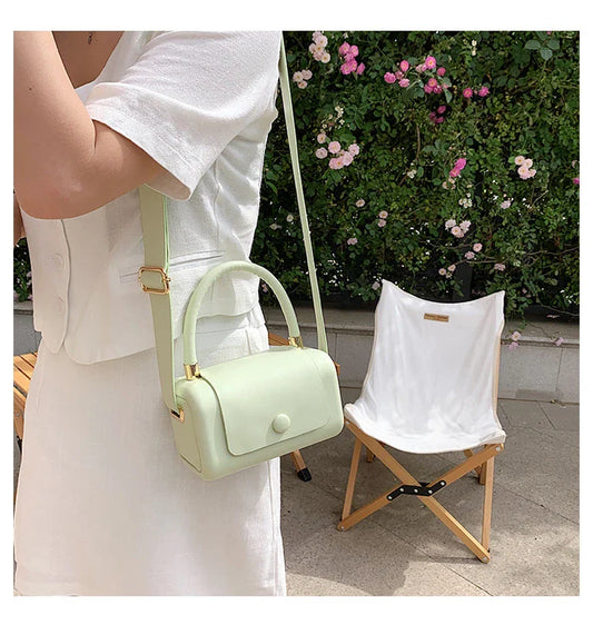 Fashionable portable square bag in various colors with a compact, minimalist design for everyday use