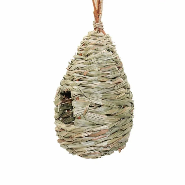 A natural straw bird nest designed to provide a cozy and secure environment for backyard birds to nest and thrive.