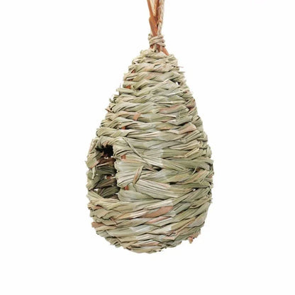 A natural straw bird nest designed to provide a cozy and secure environment for backyard birds to nest and thrive.