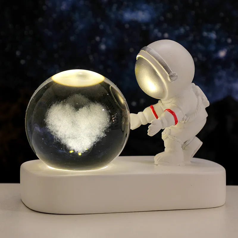 Astronaut crystal ball night light projecting galaxy pattern on 6cm resin sphere with USB cable