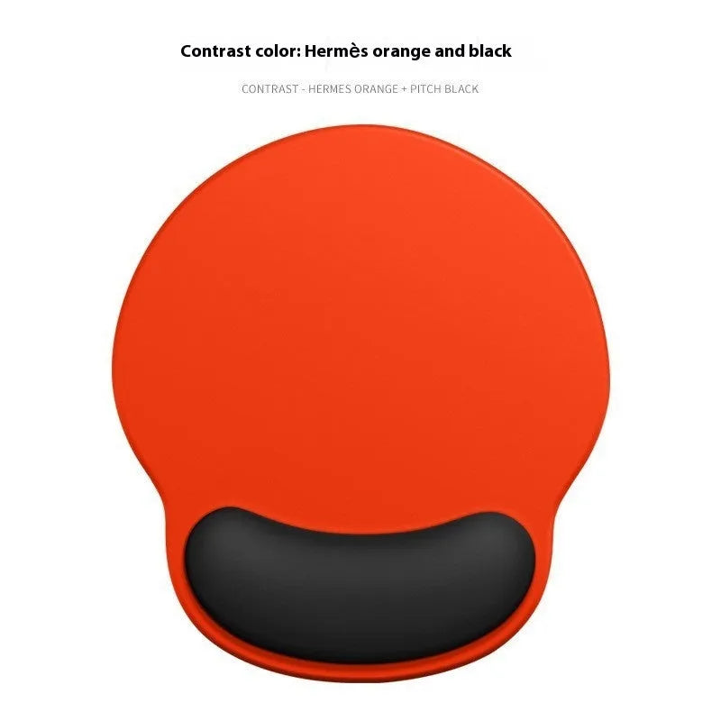 Silicone mouse mat with wristband in a gradient blue black colour pattern on a desk.