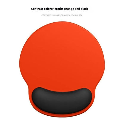Silicone mouse mat with wristband in a gradient blue black colour pattern on a desk.