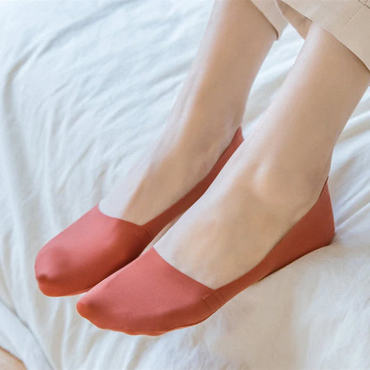 Women's cotton silicone non-slip shallow boat socks in various colors for a secure, comfortable fit.