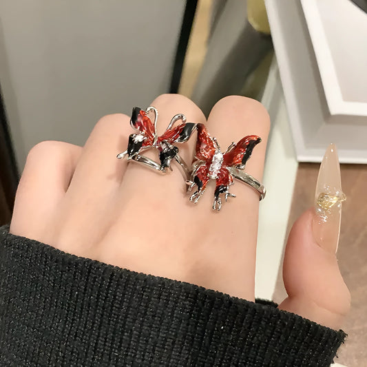 Copper women's ring with Chinese butterfly design and adjustable open loop.