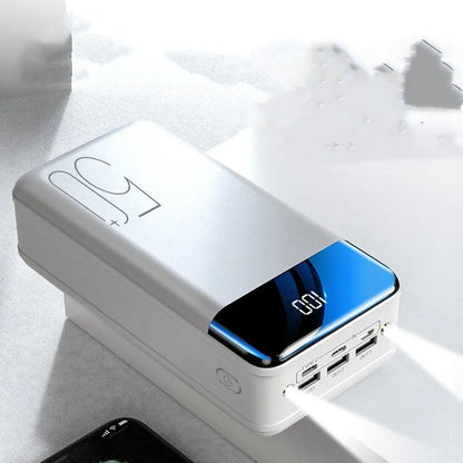 Black or white 50000mAh power bank with three USB output ports, measuring 169x83x52mm