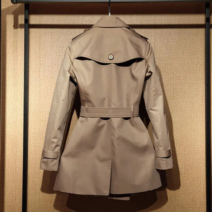 Khaki women's trench coat with double-breasted front and structured shoulder detailing