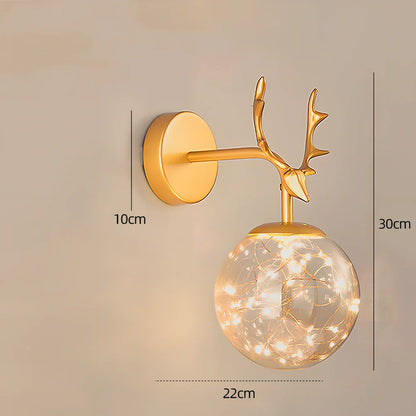 Crystal bedside lamp with stainless steel base and transparent shade providing soft illumination