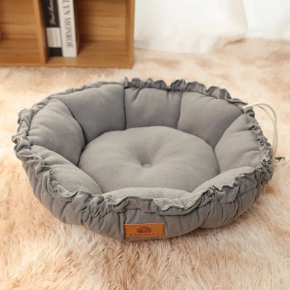 Reversible grey and green donut-shaped pet bed for cats and small dogs