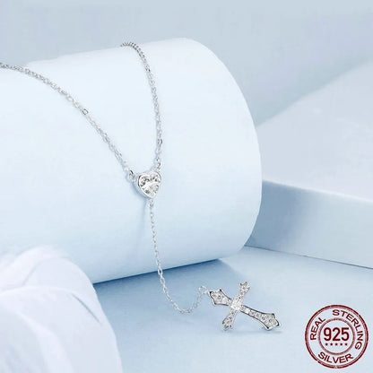 Silver cross pendant necklace with V-neck design on O-ring chain