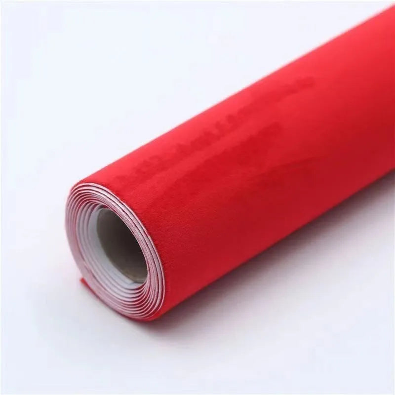 Rolls of self-adhesive leather suede in multiple colours showing texture and adhesive backing.