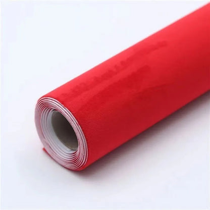 Rolls of self-adhesive leather suede in multiple colours showing texture and adhesive backing.
