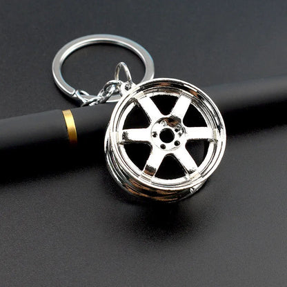 Zinc alloy car wheel hub keychain in black, gold and silver colour options
