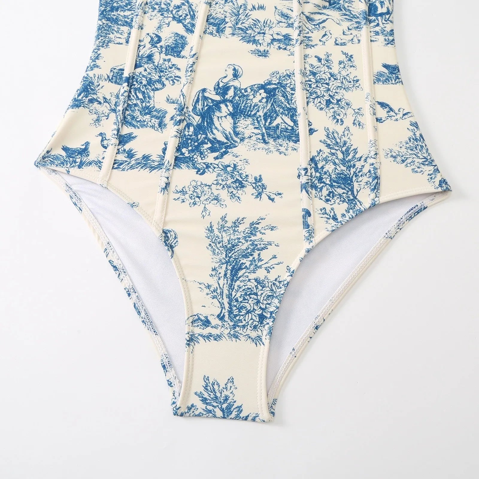Blue patterned one-piece swimsuit for women with a skirt option.