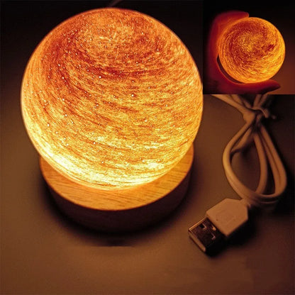 Planet-shaped USB night light with adjustable dimming in 12 colour options on its base.