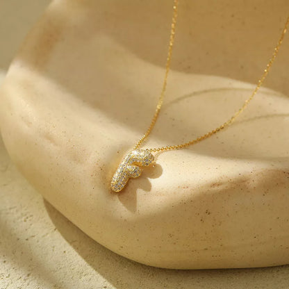 Stainless steel initial pendant necklace with zircon accents, personalized with your choice of letter.