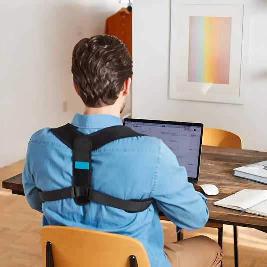 Black adjustable posture correction strap with metal buckle on a grey background.