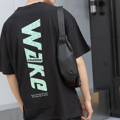 Black Oxford cloth waist pack measuring 12cm high by 27cm wide with crossbody strap and zipper closure