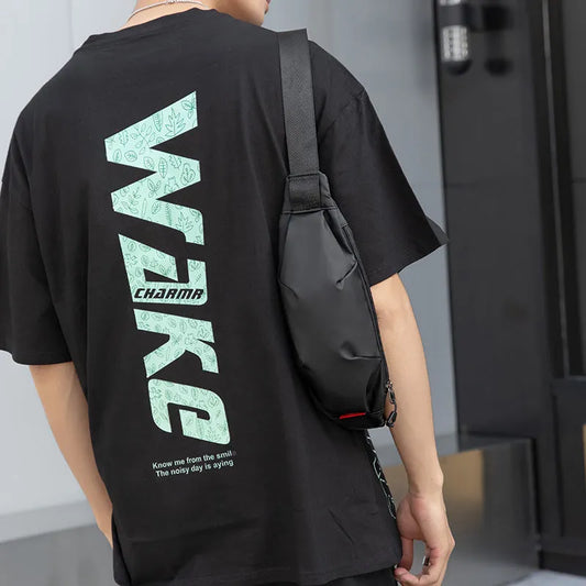 Black Oxford cloth waist pack measuring 12cm high by 27cm wide with crossbody strap and zipper closure