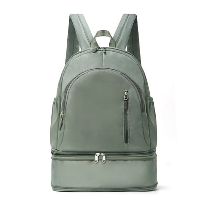 Women's casual backpack in black with adjustable curved shoulder straps and contrast stitching, 20-35L waterproof polyester.