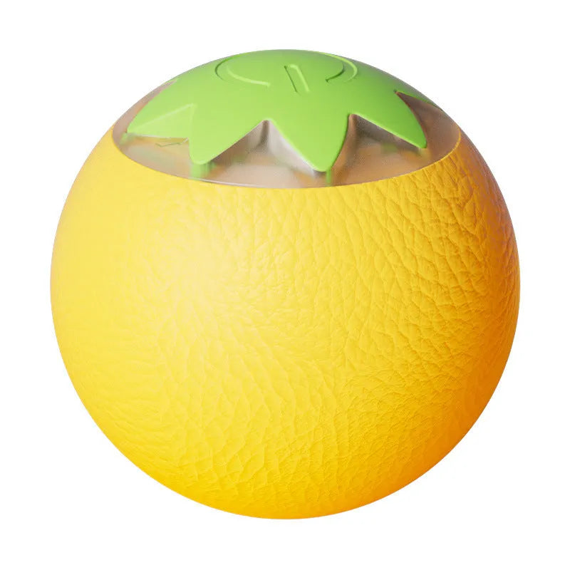 Green automatic rotating ball pet toy for dogs and cats on indoor flooring