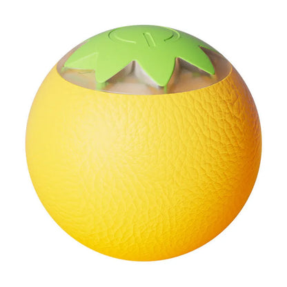 Green automatic rotating ball pet toy for dogs and cats on indoor flooring
