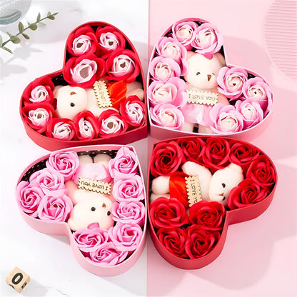 Red heart-shaped gift box open to reveal soap roses inside.
